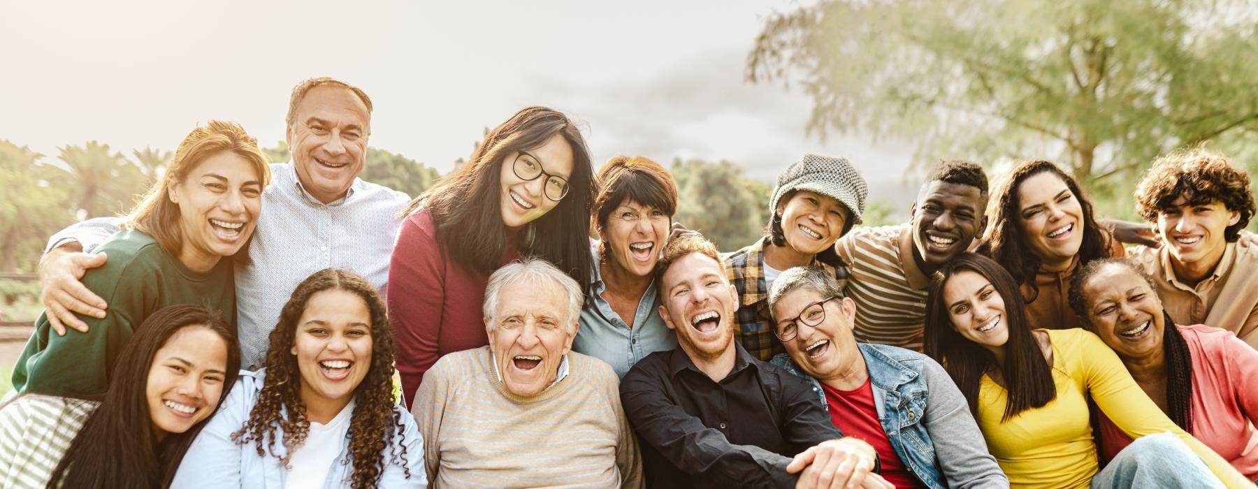 a group of people sitting together smiling