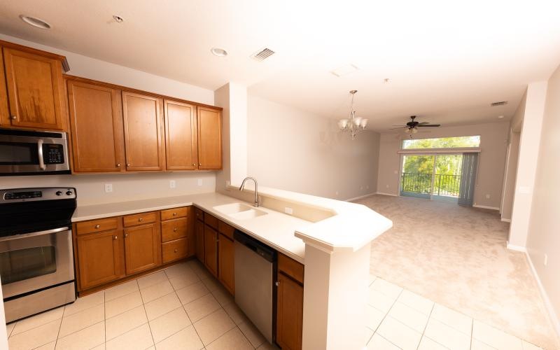 a kitchen with wooden cabinets
