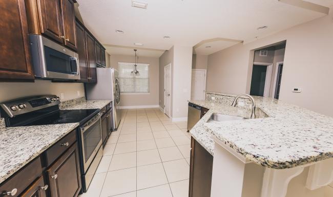 a kitchen with a marble counter top