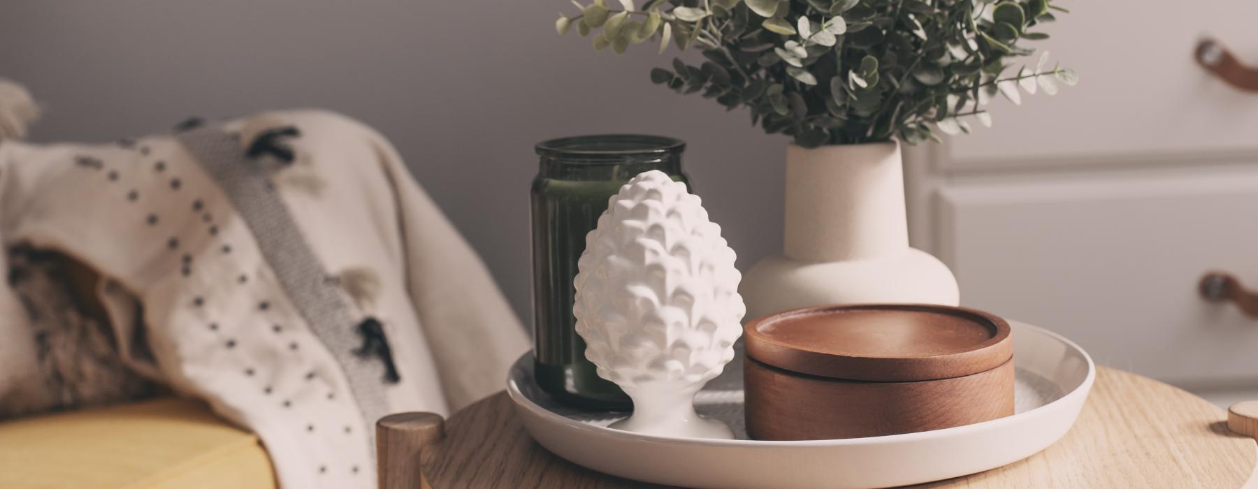 a vase with white flowers on a table